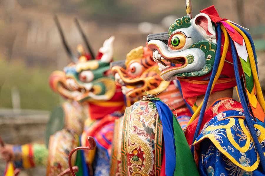 Mask Dancers at Tshechu Festival — Paro Valley, Bhutan — Fine art canvas print by Naomi McLeod