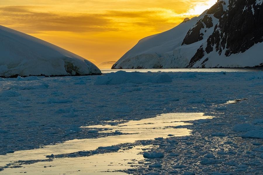 Golden Hour Over Ice — Lemaire Channel, Antarctica — Fine art canvas print by Naomi McLeod
