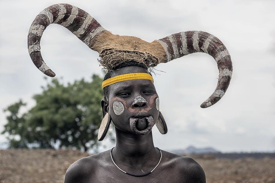 Mursi Tribe Portrait — Omo Valley, Ethiopia | Ceremonial Headdress — Fine art canvas print by Naomi McLeod