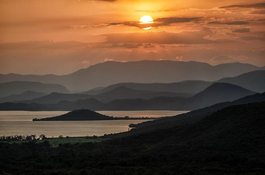 Sunset Over African Mountains — Layered Ridges and Lake at Dusk — Fine art canvas print