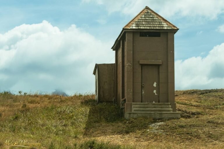 Weathered Hilltop Building Under Dramatic Cloudy Sky