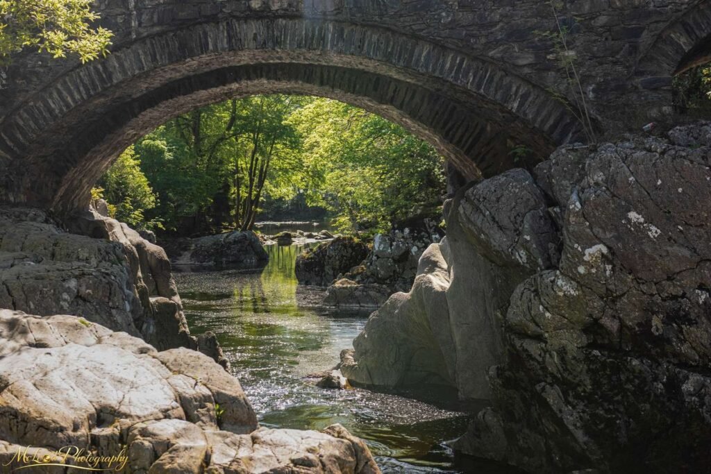 Ancient Stone Arch Bridge Over Scottish Highland River — Fine art canvas print by Naomi McLeod