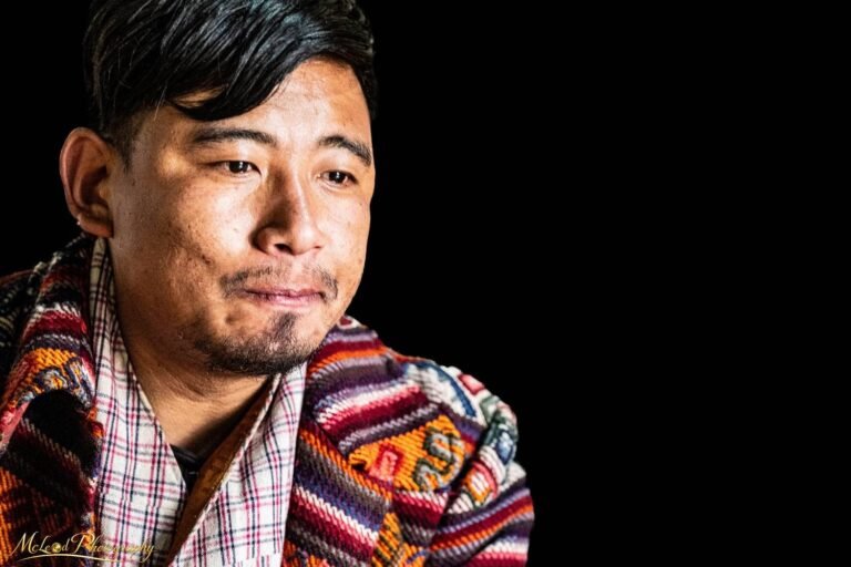 Bhutanese Man in Traditional Woven Textile Portrait