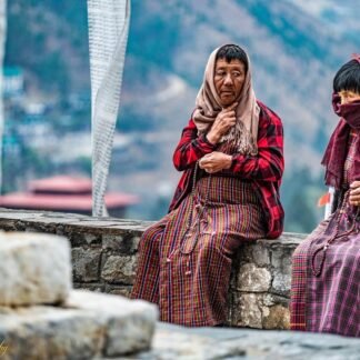 Bhutanese Women in Prayer at Himalayan Mountain Temple