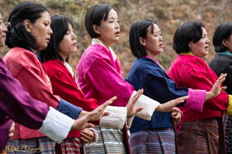 Bhutanese Women in Traditional Kira Singing at Festival