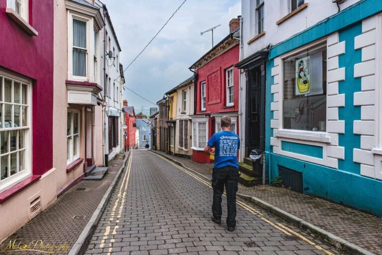 Colorful Welsh Village Street with Cobblestones Wall Art