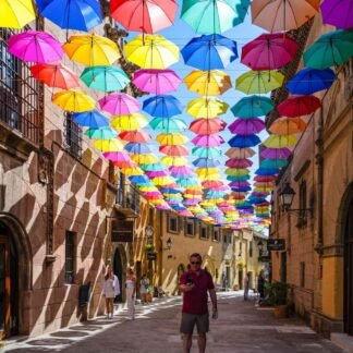 Colorful Floating Umbrellas Over Historic Spanish Street