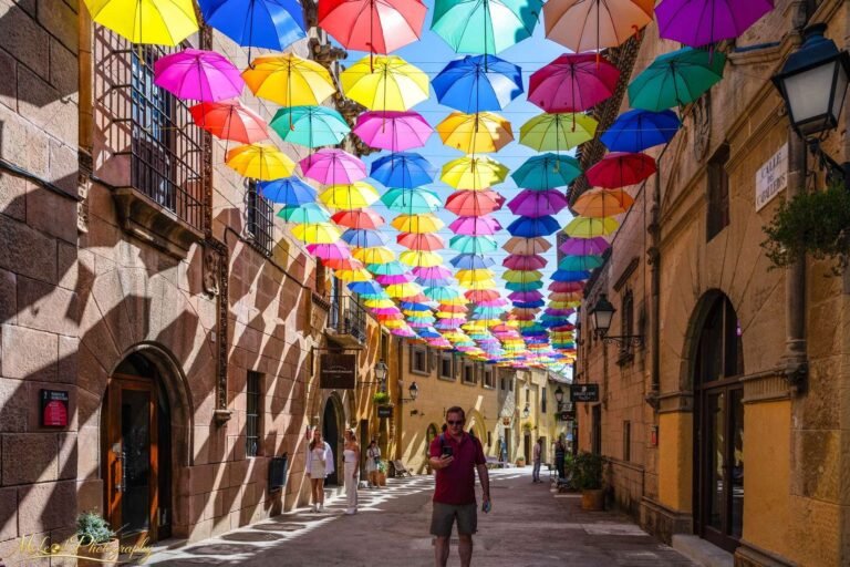 Colorful Floating Umbrellas Over Historic Spanish Street