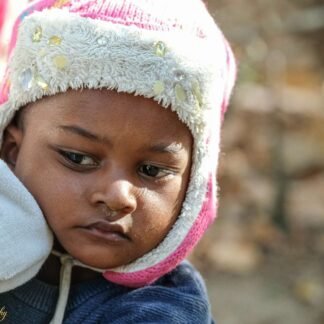 Contemplative Child in Pink Winter Hat - Fine Art Portrait