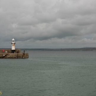 Cornish Harbour Lighthouse Under Moody Skies Fine Art Print
