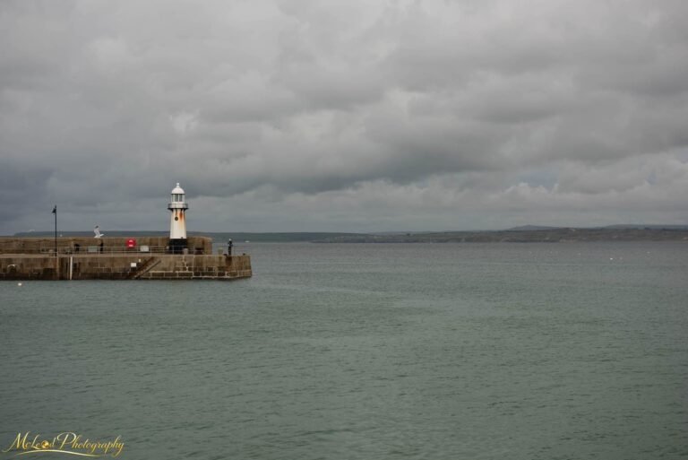 Cornish Harbour Lighthouse Under Moody Skies Fine Art Print