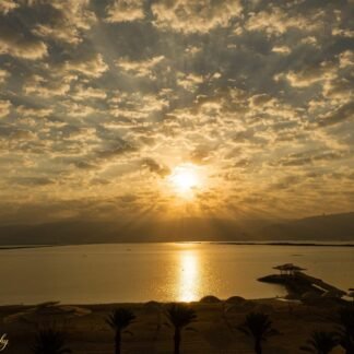 Golden Sunset Over Dead Sea with Dramatic Cloud Rays