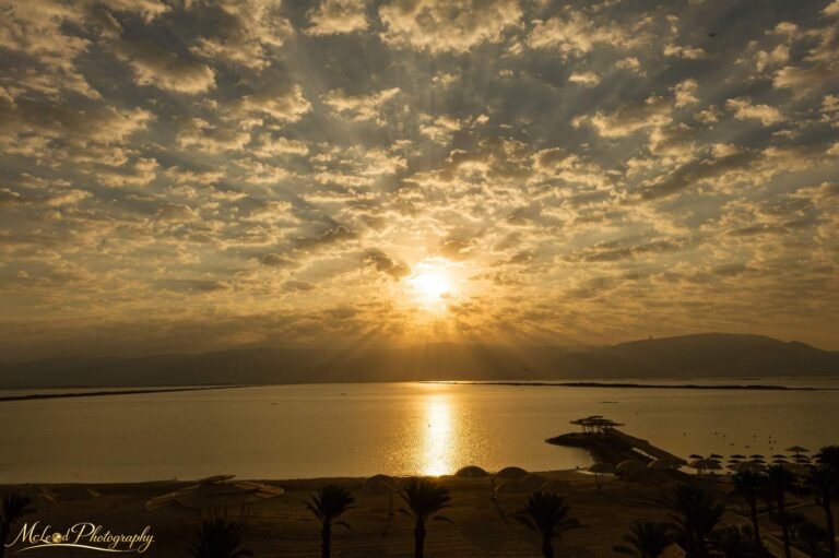 Golden Sunset Over Dead Sea with Dramatic Cloud Rays