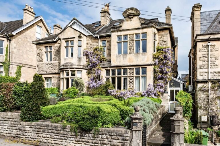 Georgian Stone Townhouse with Purple Wisteria in Bloom