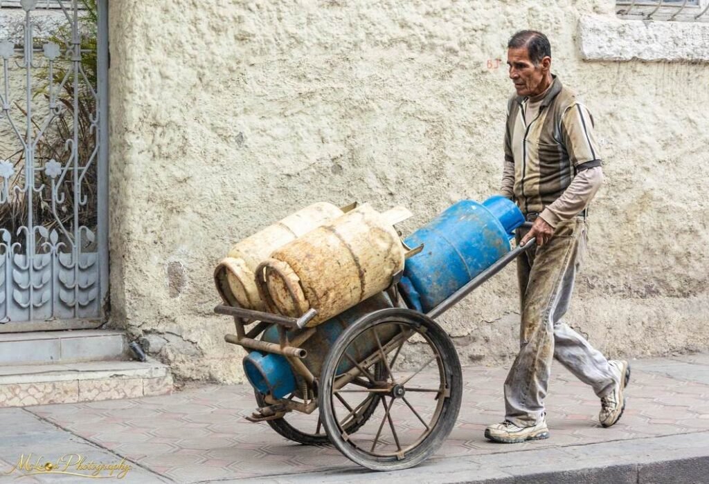 Gas Vendor Pushing Cart Through Ancient Streets Wall Art — Fine art canvas print by Naomi McLeod