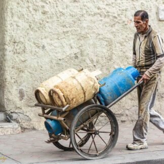 Gas Vendor Pushing Cart Through Ancient Streets Wall Art