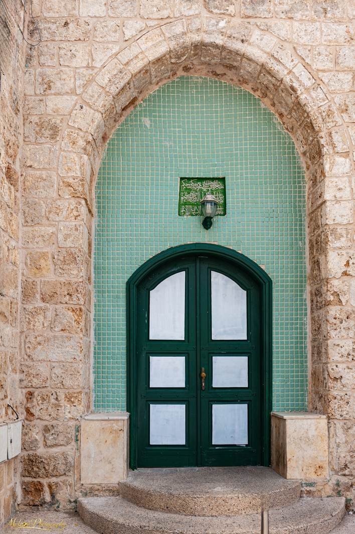 Green Arched Doorway in Jerusalem Old City Stone Wall