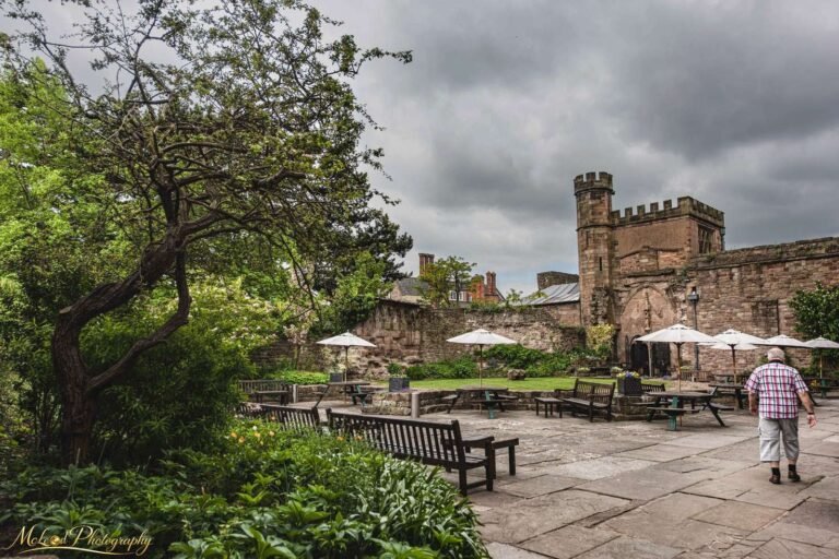 Historic English Castle Garden Courtyard Under Moody Skies