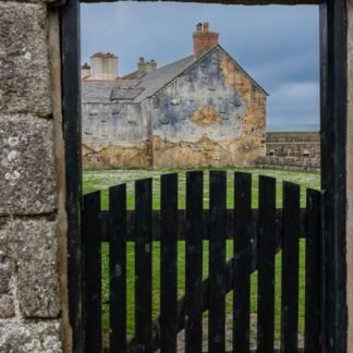 Maritime Mural Through Ancient Stone Gateway Scotland