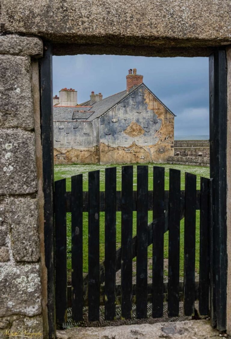 Maritime Mural Through Ancient Stone Gateway Scotland