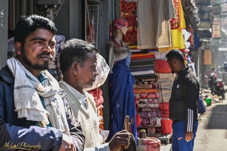 Indian Street Market Vendors Among Colorful Textiles