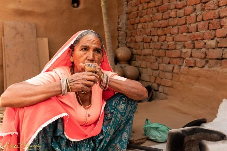 Indian Woman Drinking Chai in Rajasthan Village Portrait