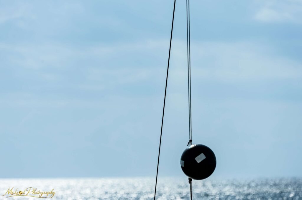 Minimalist Sailboat Rigging Against Ocean Horizon — Fine art canvas print by Naomi McLeod