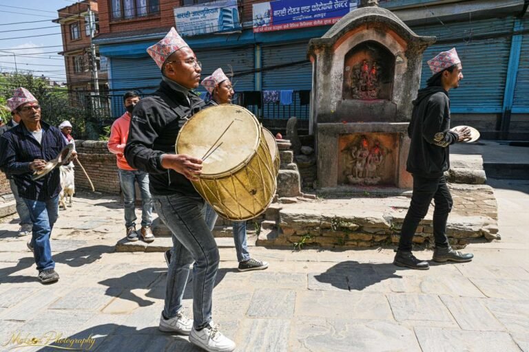 Nepali Street Musicians Playing Traditional Drums by Hindu Shrine