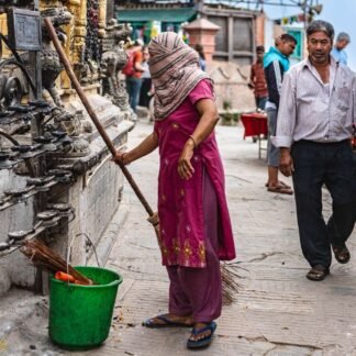 Temple Caretaker Sweeping at Sacred Shrine Kathmandu Nepal