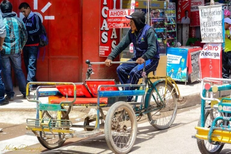 Peruvian Tricycle Taxi Driver in Vibrant Market Street
