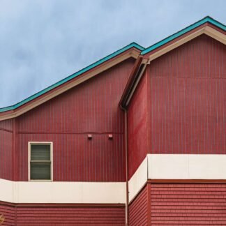 Red Wooden Building with Teal Trim Architectural Detail