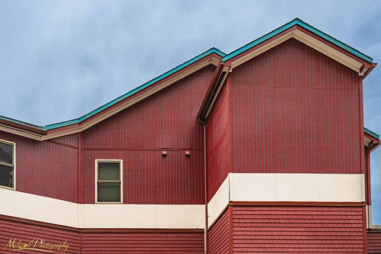 Red Wooden Building with Teal Trim Architectural Detail