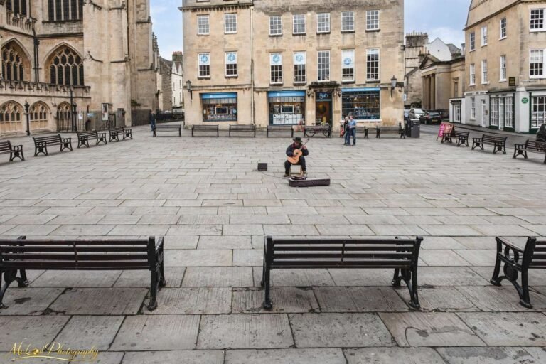 Street Musician Playing Guitar in Bath Abbey Courtyard
