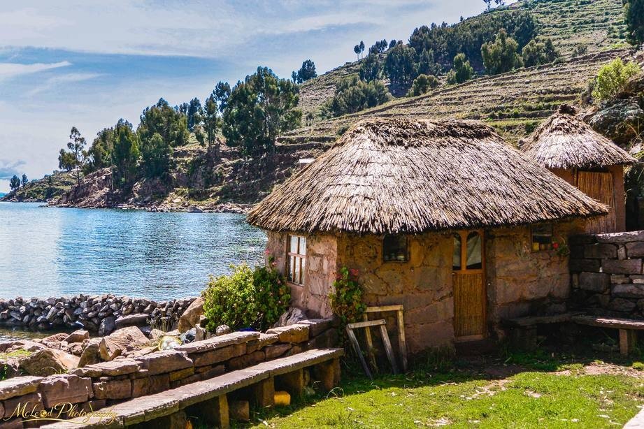 Traditional Thatched Stone Cottage on Lake Titicaca Shore — Fine art canvas print by Naomi McLeod