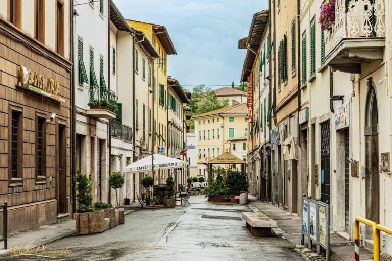 Charming Tuscan Village Street with Green Shutters Italy