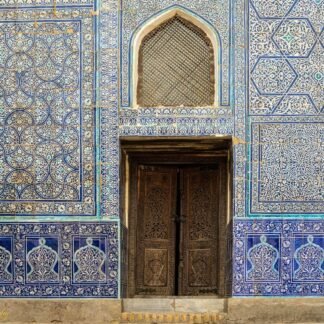 Ornate Islamic Blue Tile Facade with Carved Wooden Door