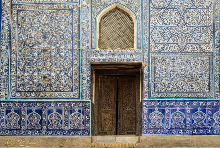 Ornate Islamic Blue Tile Facade with Carved Wooden Door