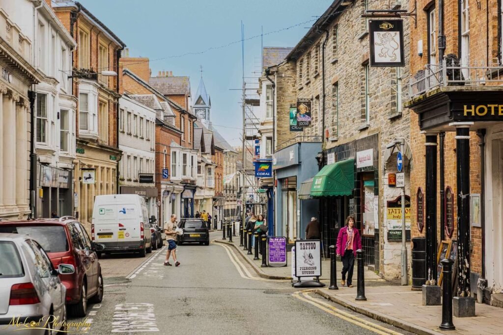 Historic Welsh Market Town High Street Scene — Fine art canvas print by Naomi McLeod